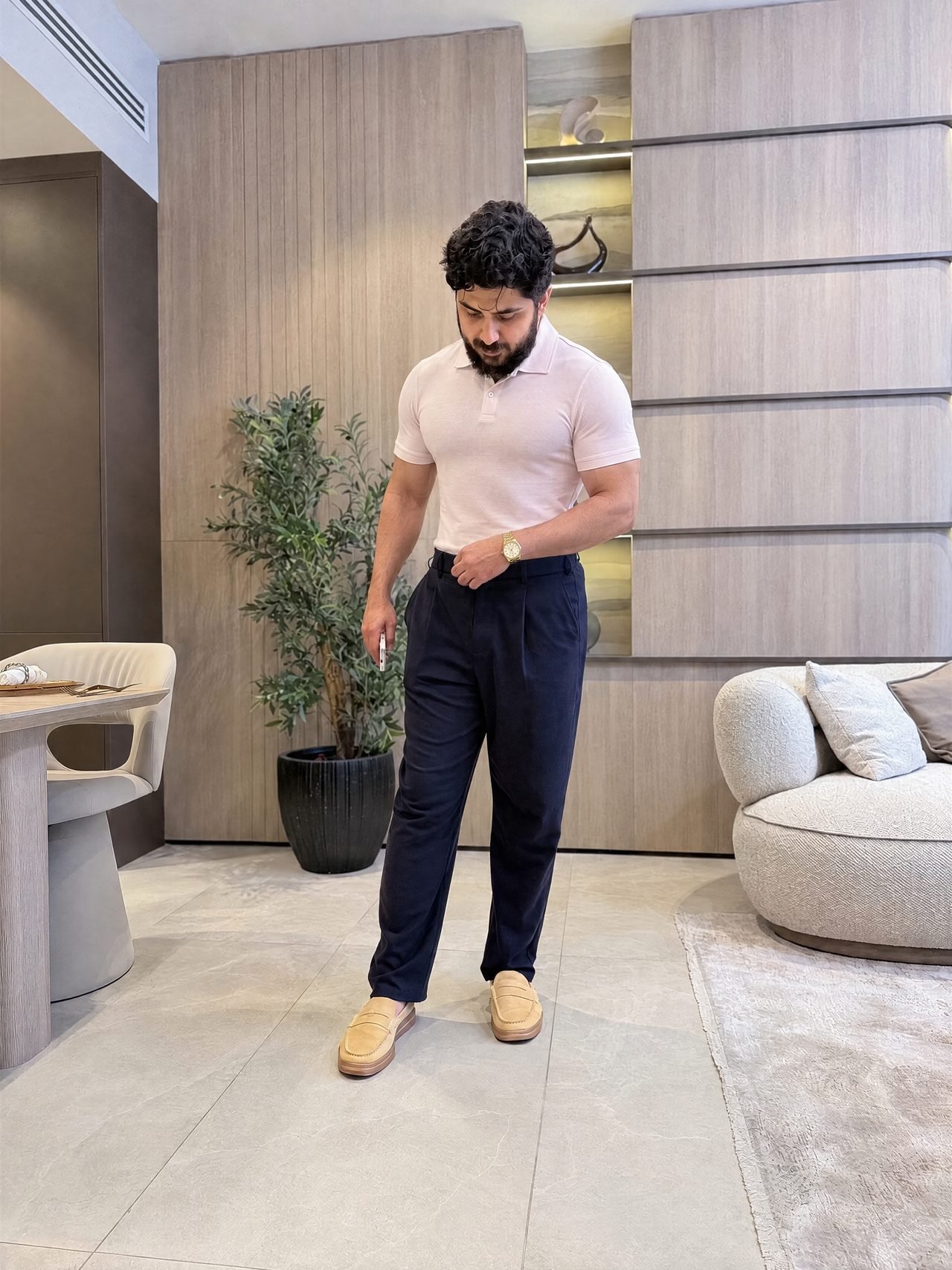 Muhammad Khan, Chairman of Hamd Holdings, standing in a Dubai interior
